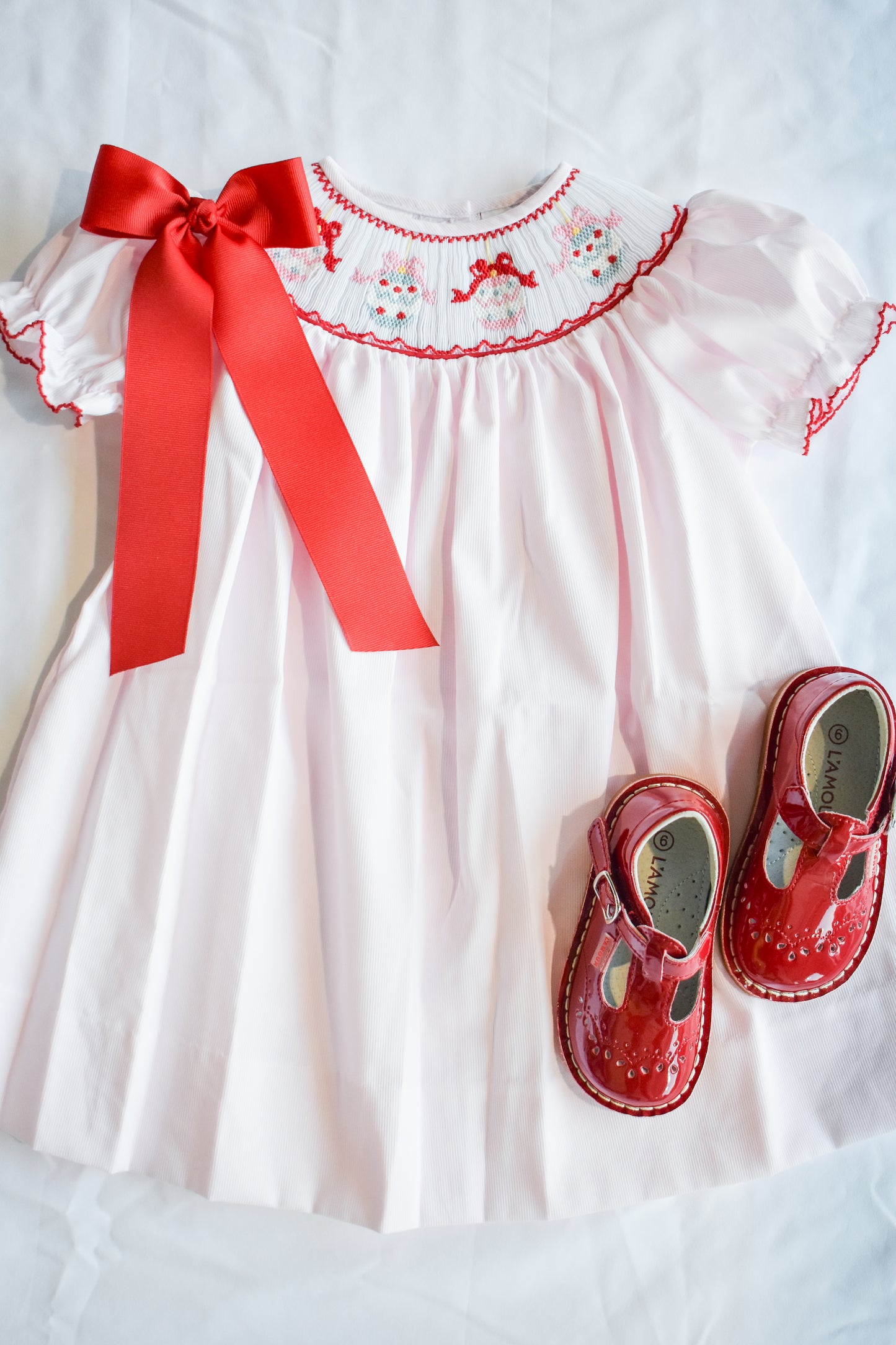 Jolly Jingles Pink Smocked Bishop Dress