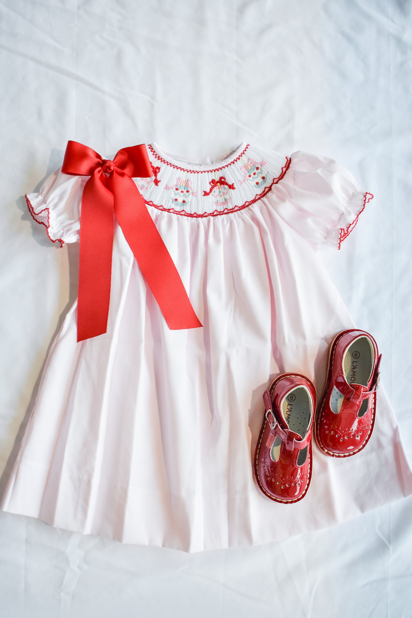 Jolly Jingles Pink Smocked Bishop Dress