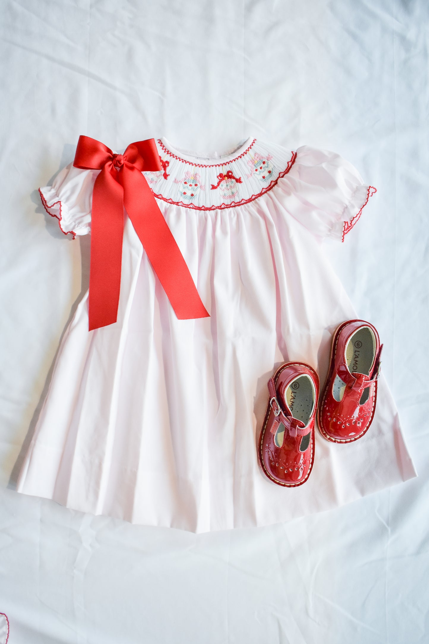 Jolly Jingles Pink Smocked Bishop Dress