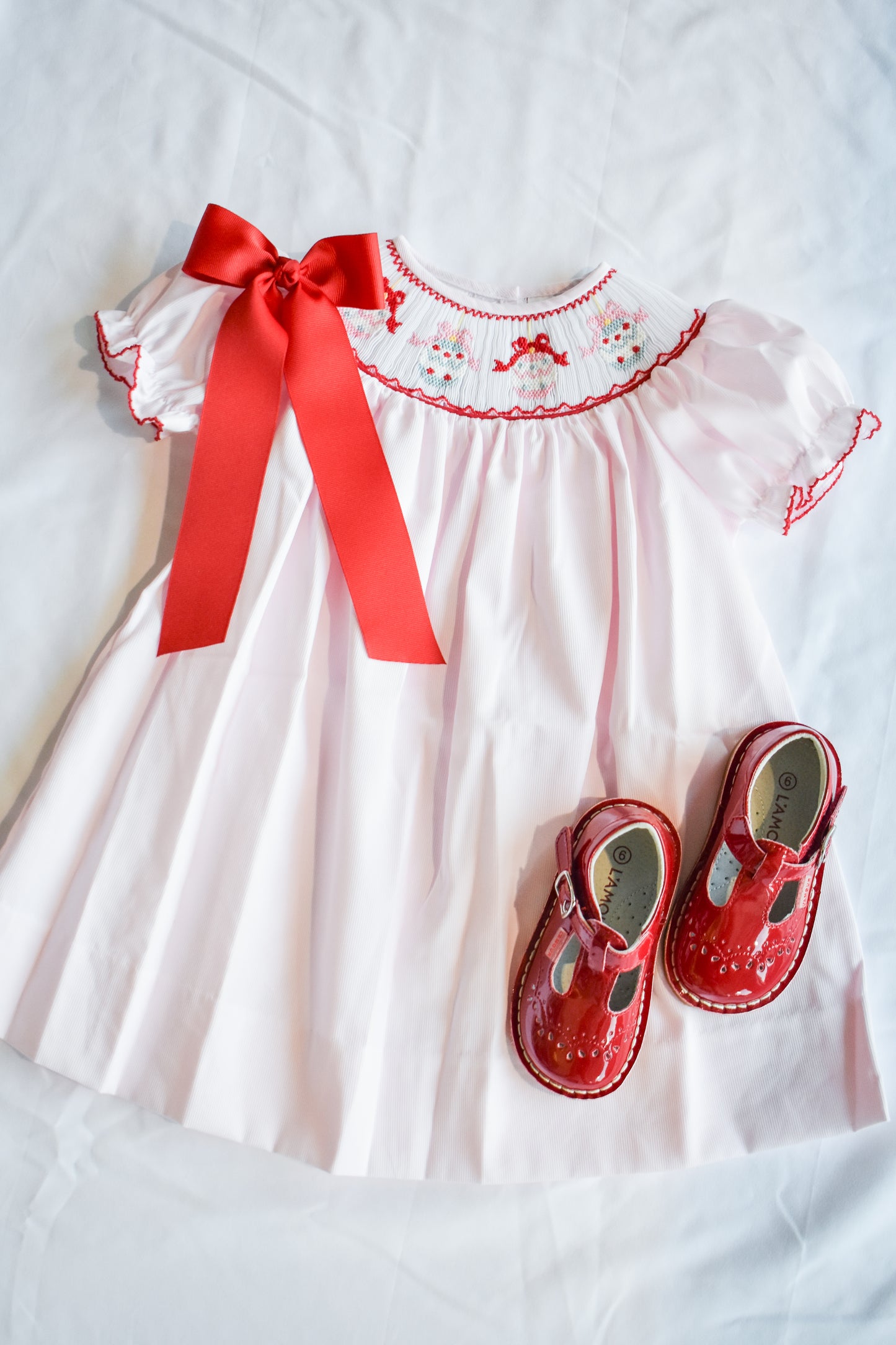 Jolly Jingles Pink Smocked Bishop Dress