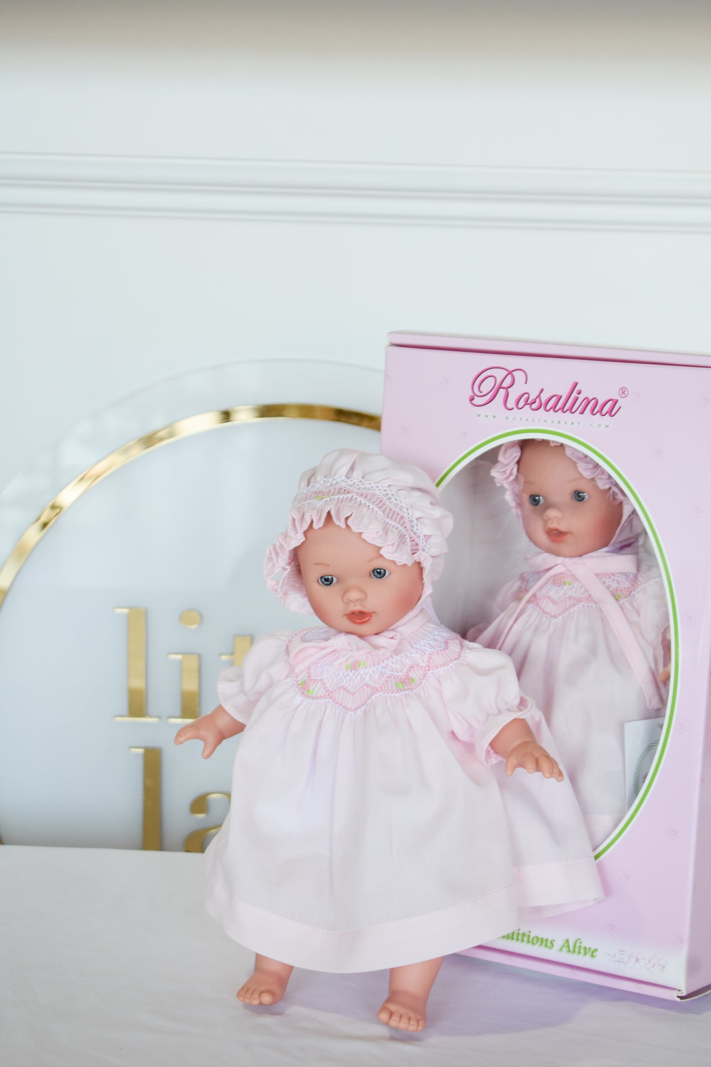 Abby Bald w/ Bonnet Doll-Pink Smocked Dress