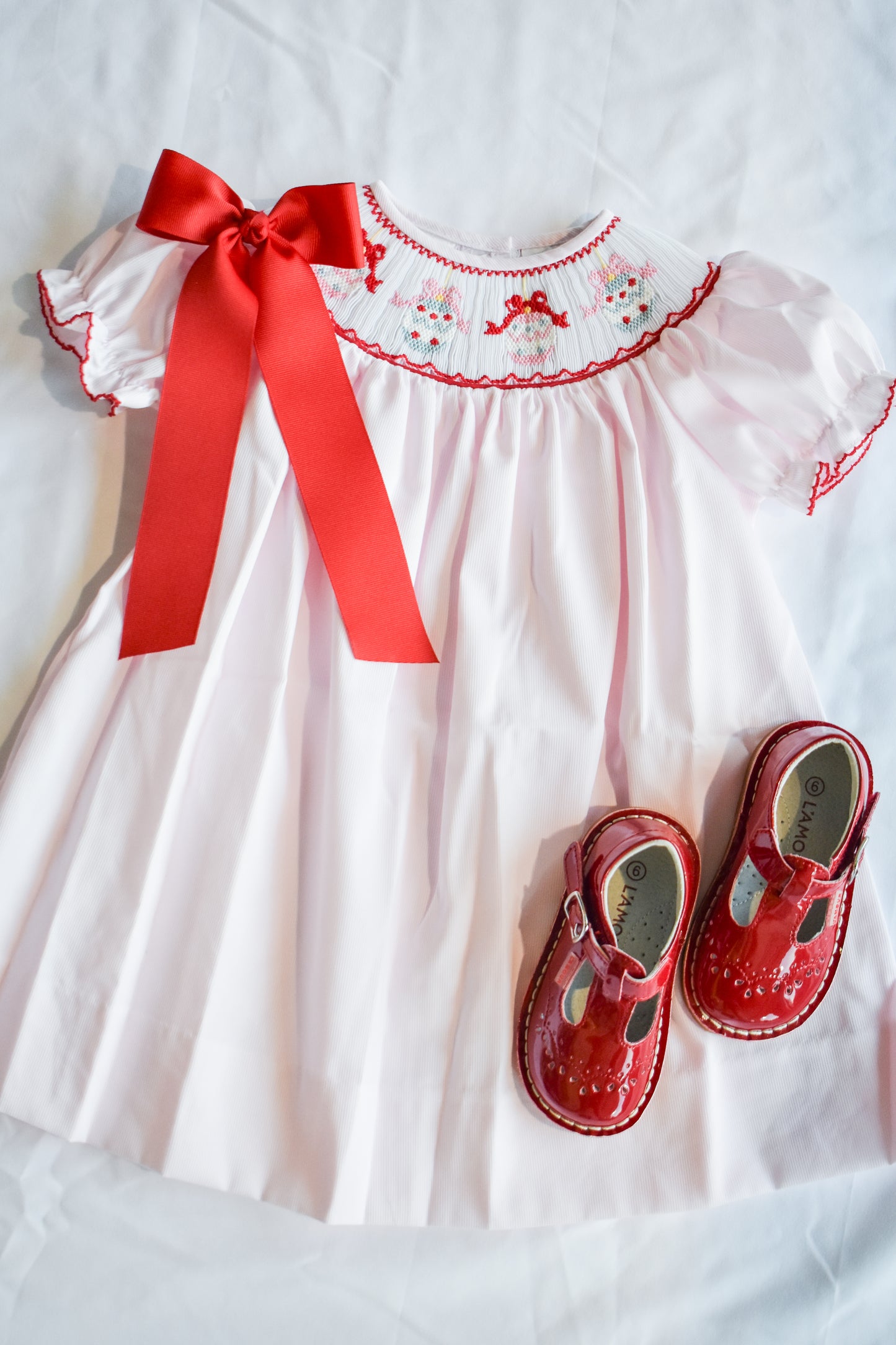 Jolly Jingles Pink Smocked Bishop Dress