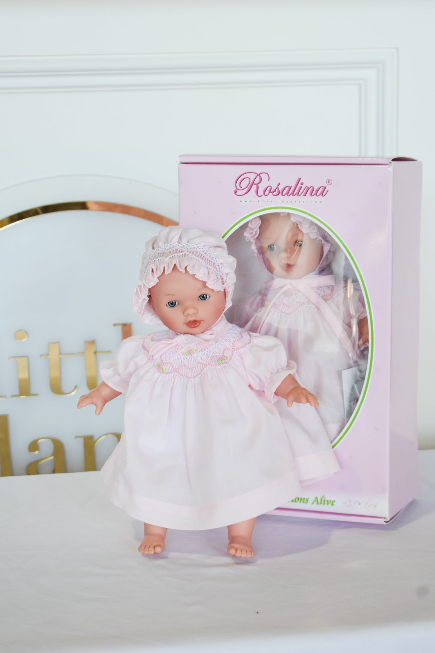 Abby Bald w/ Bonnet Doll-Pink Smocked Dress