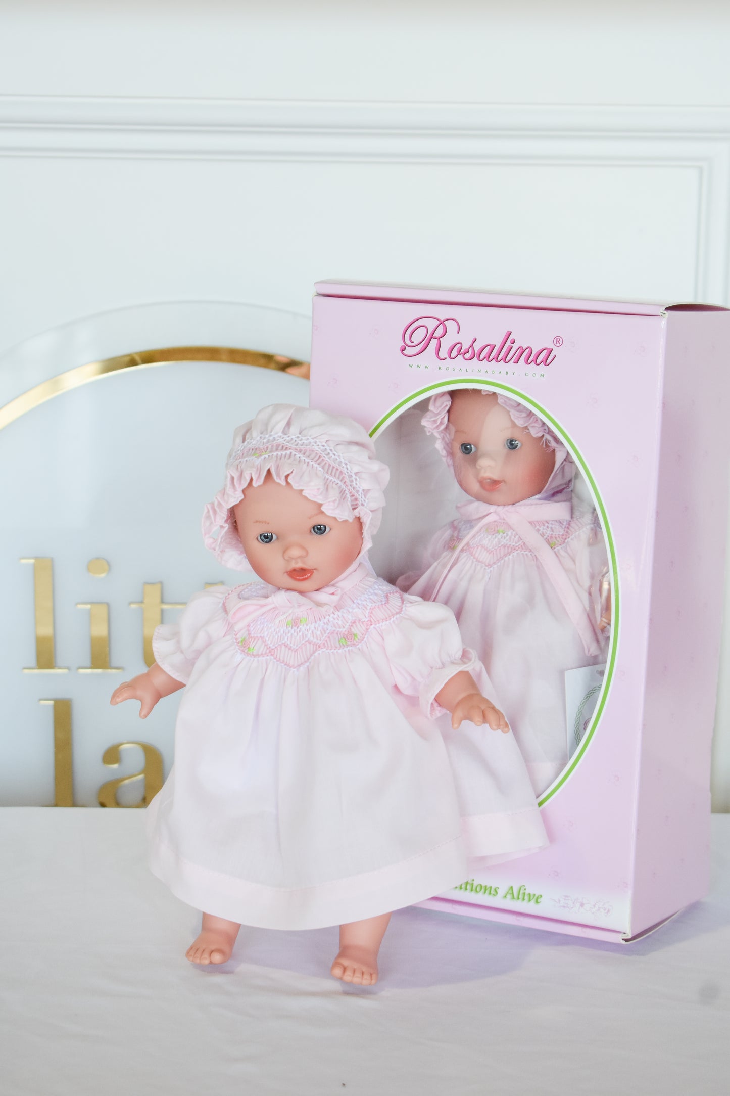 Abby Bald w/ Bonnet Doll-Pink Smocked Dress